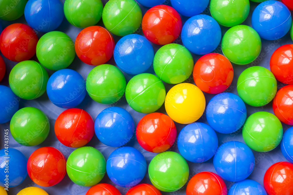 Many colorful plastic balls on children's playground Many colorful plastic balls on children's playground