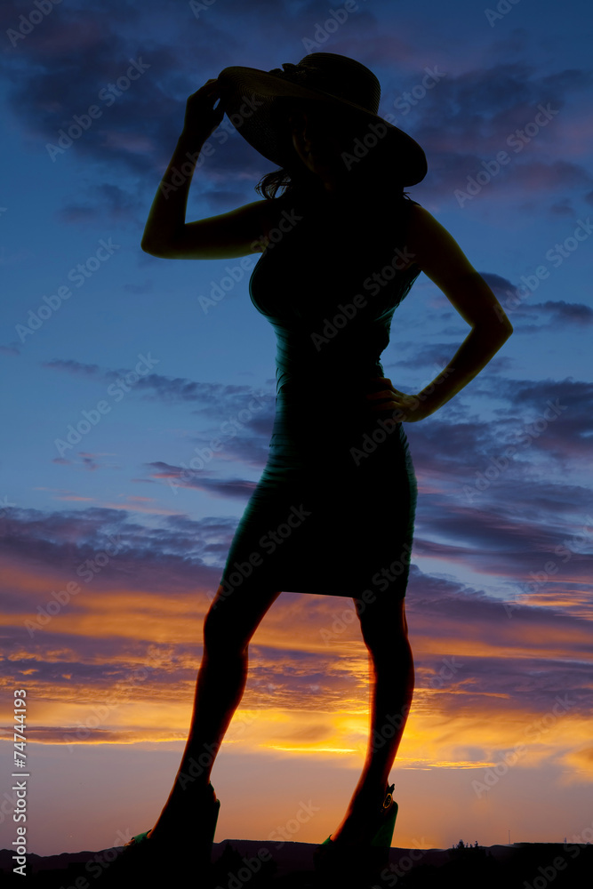 silhouette woman dress hat hand up and on hip