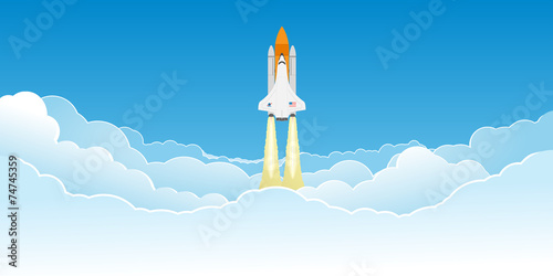 Shuttle flying in clouds.