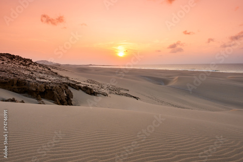 Sunset on sand dunes  in Chaves beach Praia de Chaves in Boavist