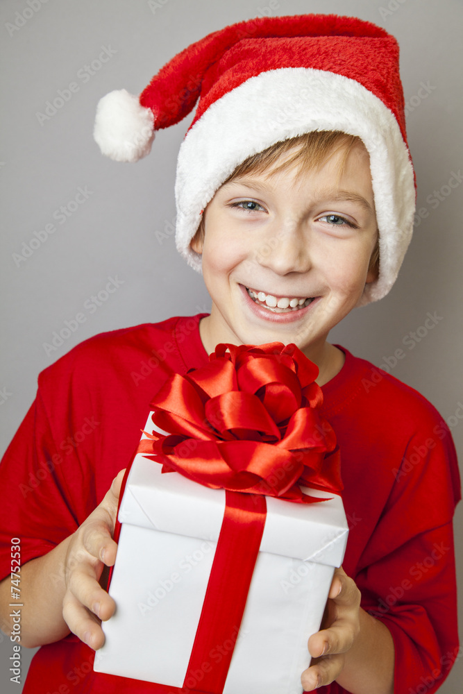 Smiling funny child in Santa red hat Smiling funny child in Santa red hat
