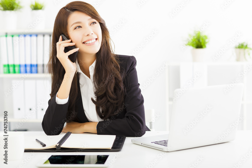 happy business woman talking on the phone in office happy business woman talking on the phone in office