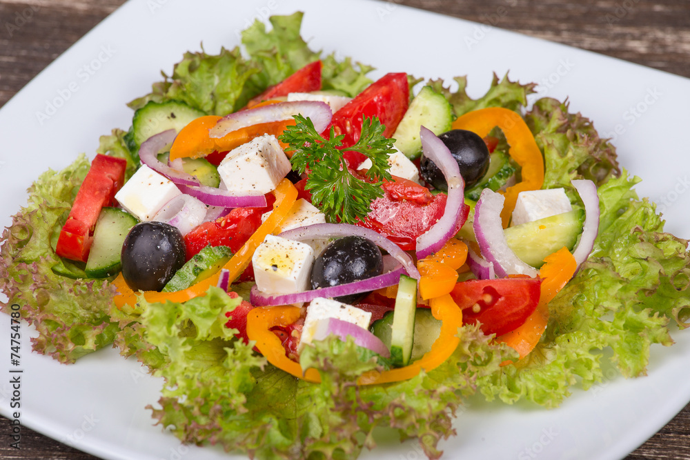 Fresh vegetable colorful greek salad in pate