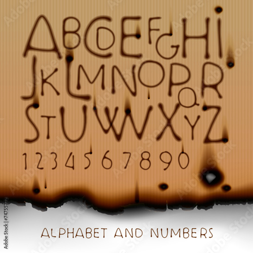 Vintage alphabet and numbers on burned out paper background