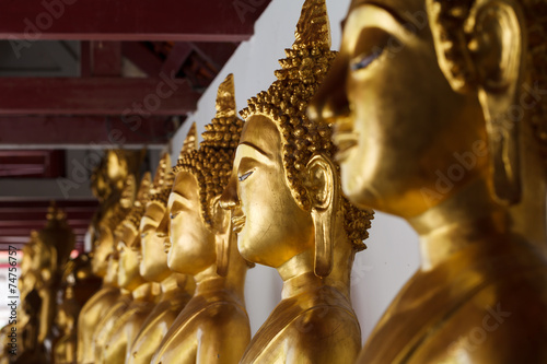 golden buddha image close-up, selective focus © sripfoto