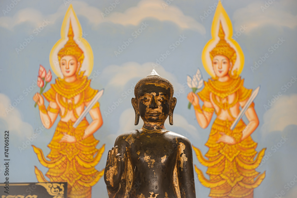 Buddha sculpture and wall art background in thailand temple