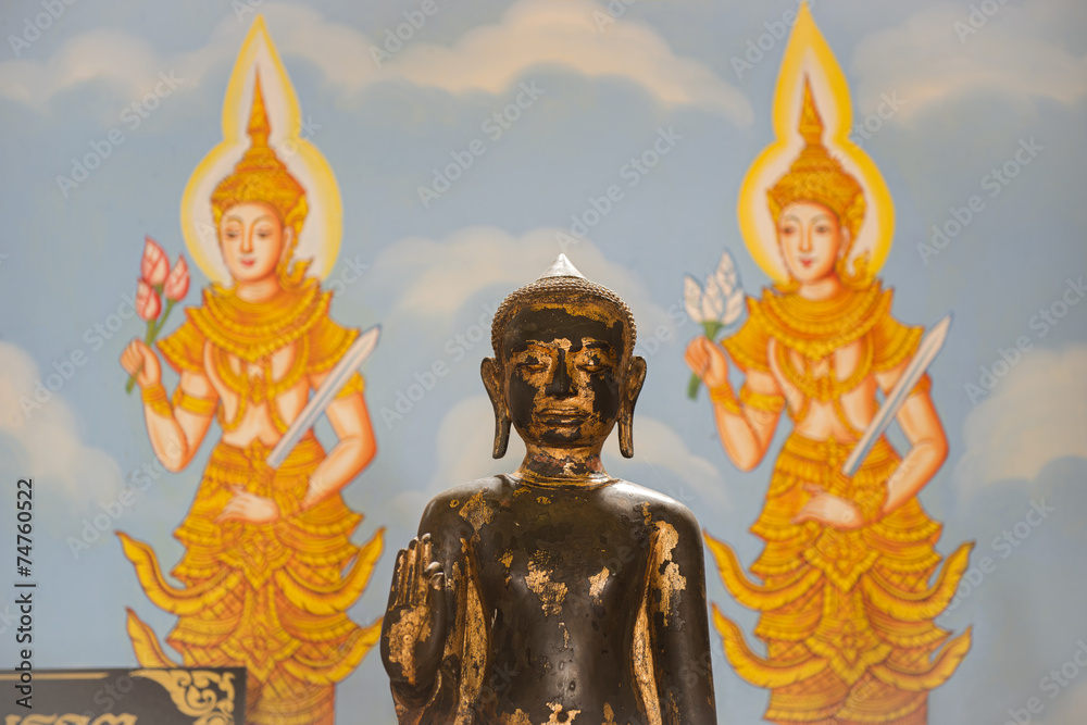 Fototapeta premium Buddha sculpture and wall art background in thailand temple