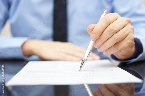 businessman find insurance scam in contract