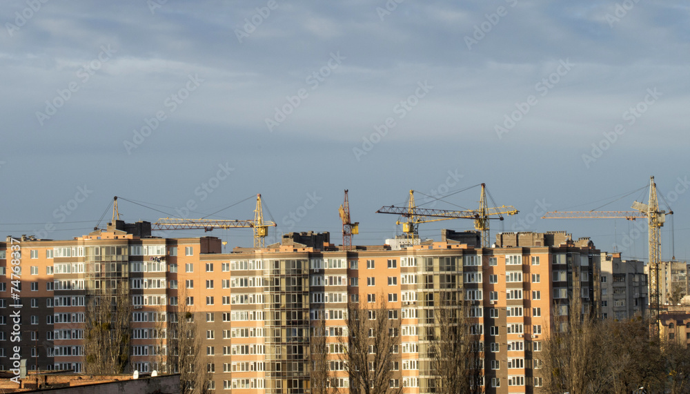 The construction of new apartment blocks in the city with the he