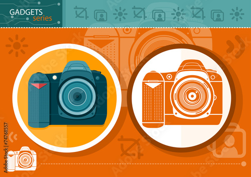 Digital camera in frame on orange background