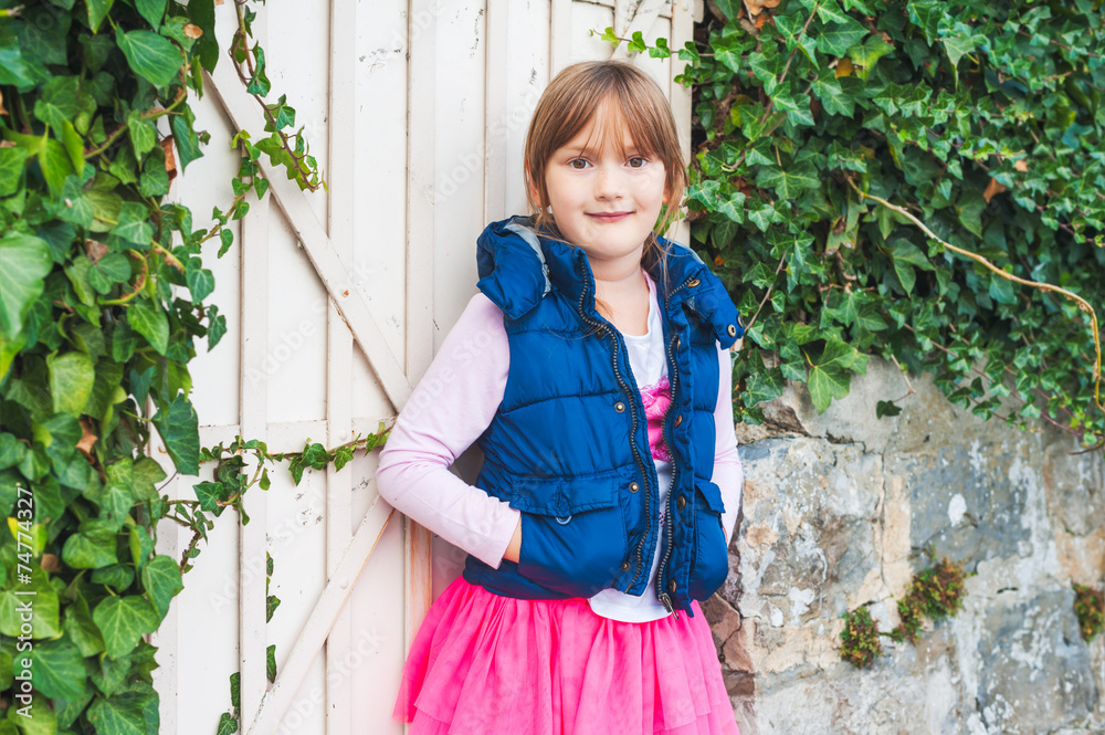 Fototapeta premium Outdoor portrait of a cute little girl