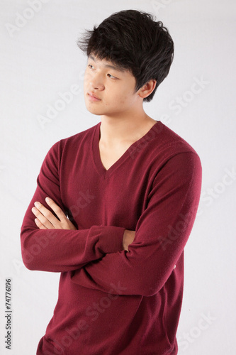 Fotografie East Asian man looking thoughtful