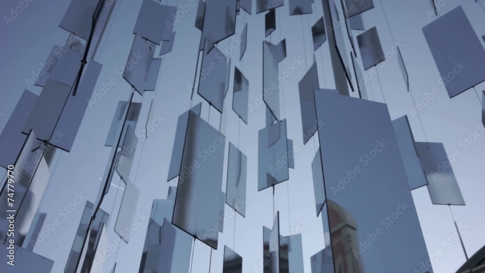 Mirrors swirling in the wind against the sky