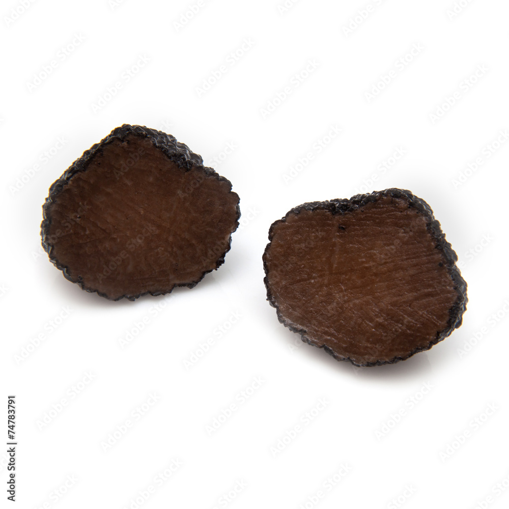 Black summer truffle isolated on a white studio background. Black summer truffle isolated on a white studio background.