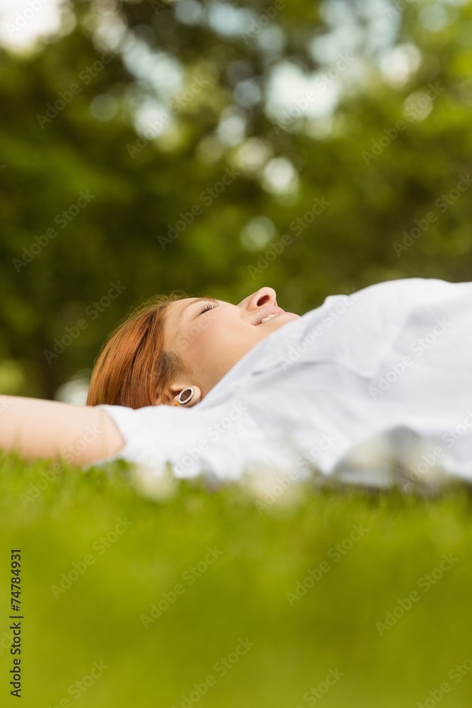 Pretty redhead smiling and lying Pretty redhead smiling and lying
