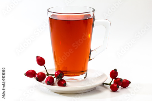 Glass of rosehip tea isolated on white background. Tisane