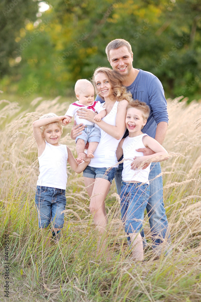 portrait of happy family relaxing in nature summer portrait of happy family relaxing in nature summer