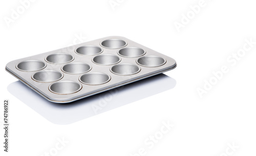 Cupcake tin pan over white background