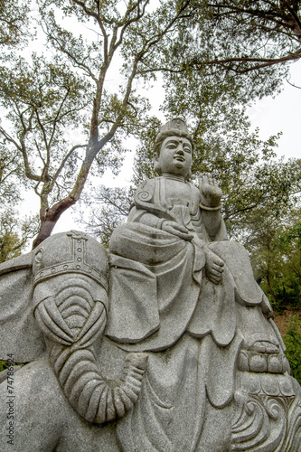 Close up view of a beautiful Buddha statue on a park. © Mauro Rodrigues