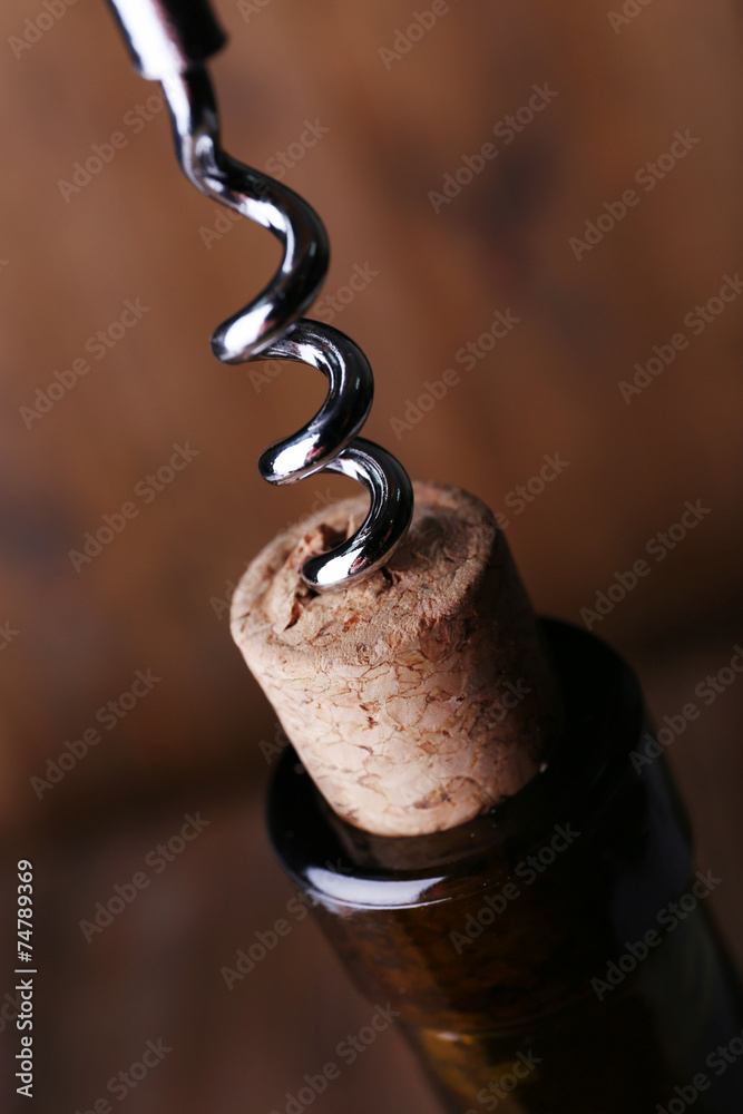 Bottle opener close-up, on wooden background Bottle opener close-up, on wooden background