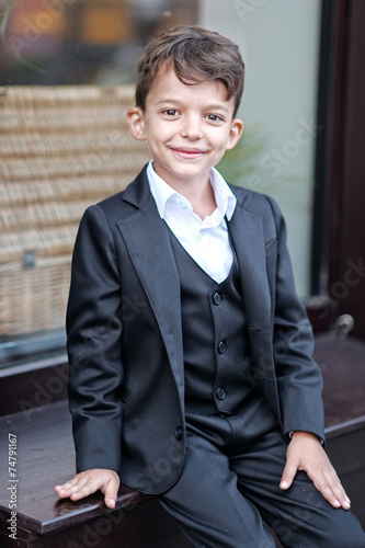 portrait of a little boy in a business style