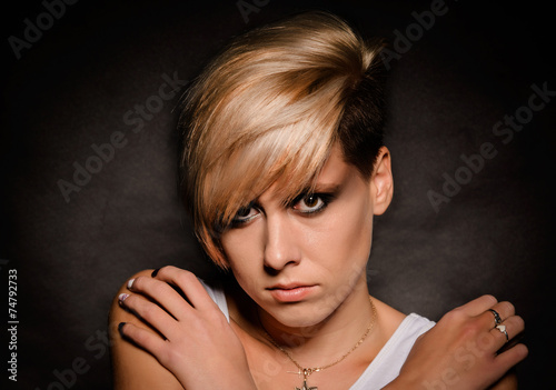 Wallpaper Mural Blonde girl with a short stylish haircut on a dark background Torontodigital.ca