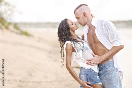 beautiful Couple in love on summer beach