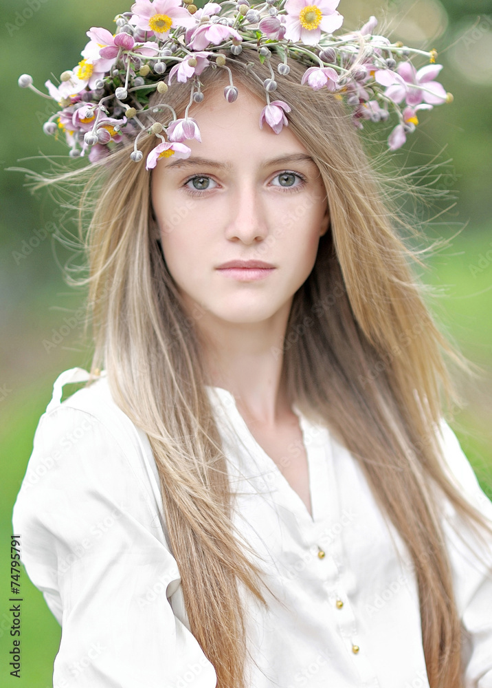 portrait of a beautiful young girl with a bouquet of flowers portrait of a beautiful young girl with a bouquet of flowers