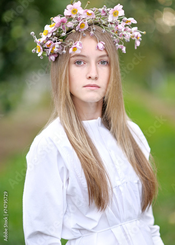 portrait of a beautiful young girl with a bouquet of flowers
