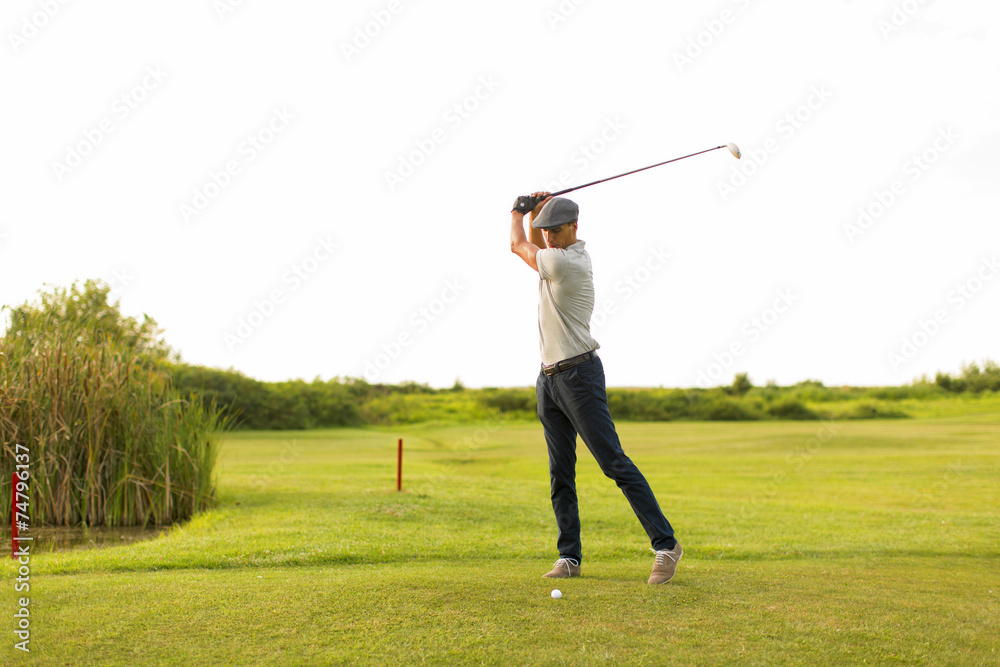 Young man playing golf