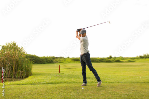 Young man playing golf