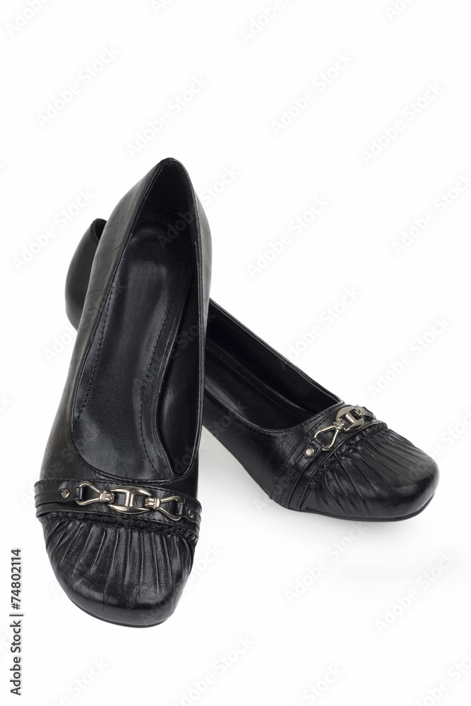 modern female's black shoes over white background