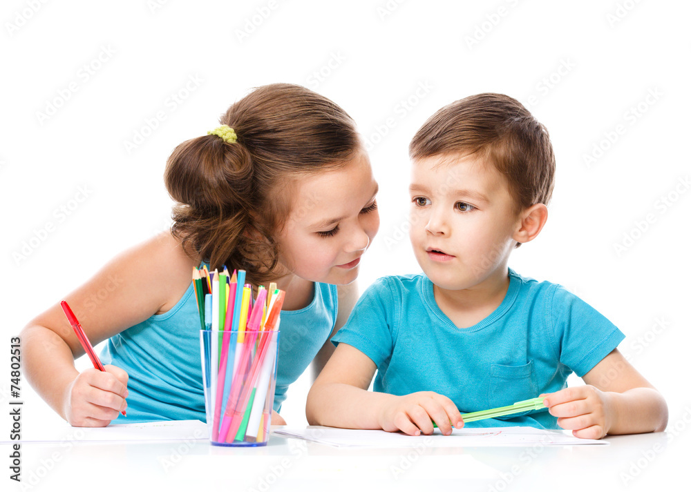 Cute children is drawing on white paper Cute children is drawing on white paper