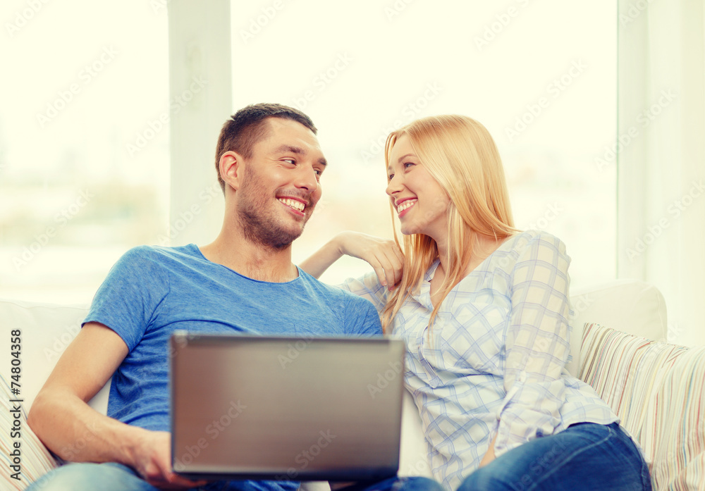 smiling happy couple with laptop at home smiling happy couple with laptop at home