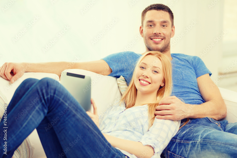 smiling happy couple with tablet pc at home smiling happy couple with tablet pc at home