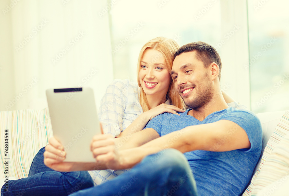 smiling happy couple with tablet pc at home smiling happy couple with tablet pc at home