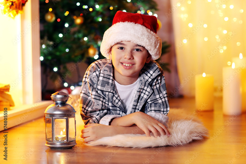 Little boy lying near fireplace in room Little boy lying near fireplace in room