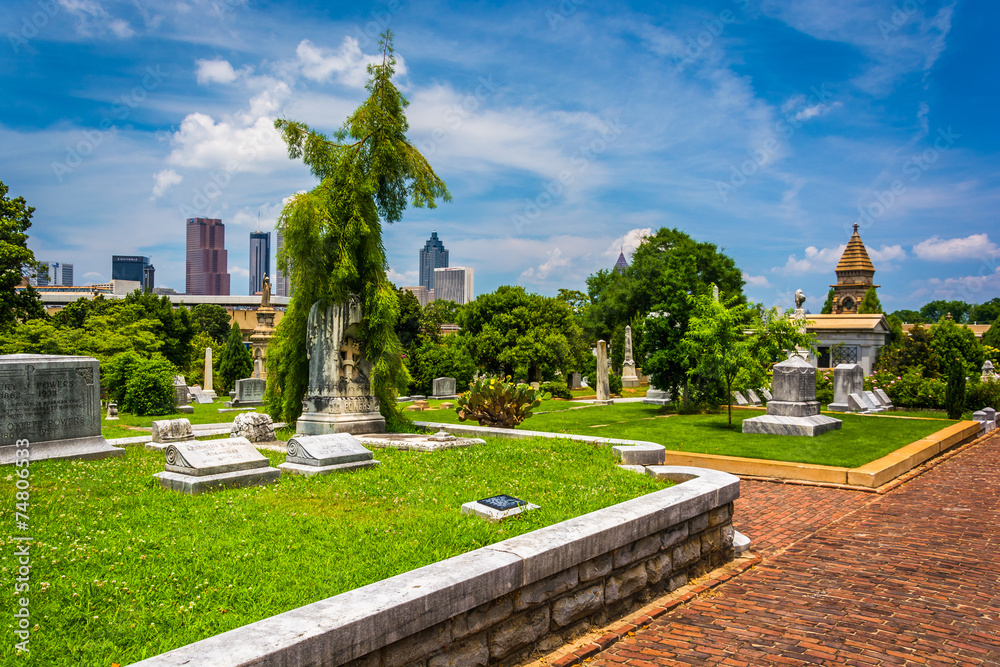 Graves and view of the Atlanta skyline at Oakland Cemetary in At