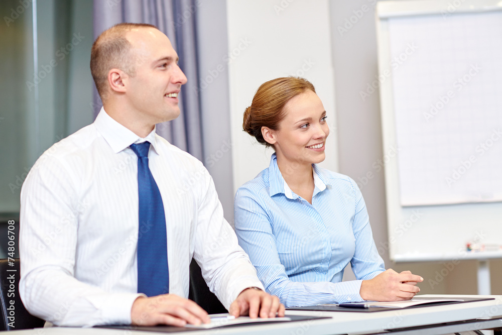 group of smiling businesspeople meeting in office group of smiling businesspeople meeting in office
