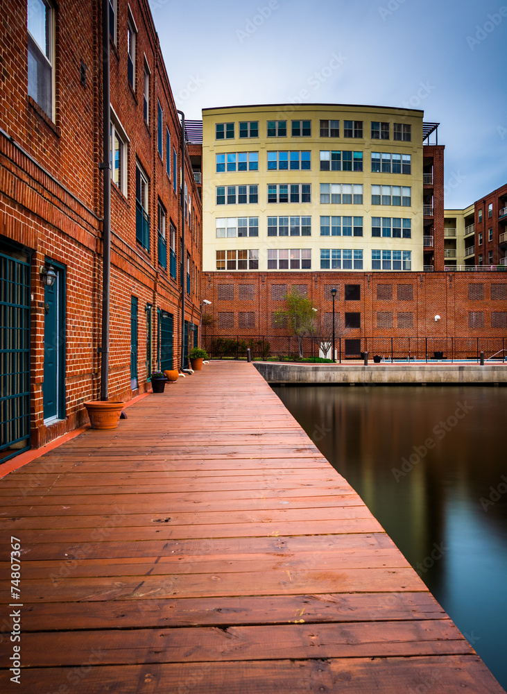 Long exposure of buildings along the waterfront in Fells Point,