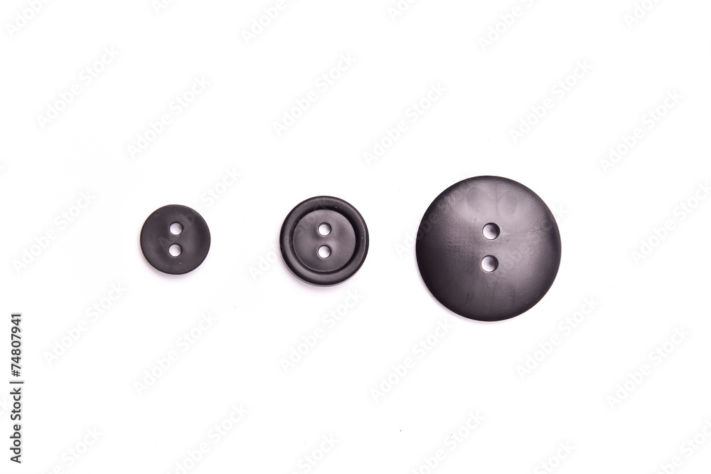 Black plastic buttons with two pins on White Isolate Background Black plastic buttons with two pins on White Isolate Background