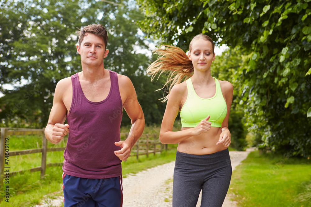 Couple On Run In Countryside Together Couple On Run In Countryside Together