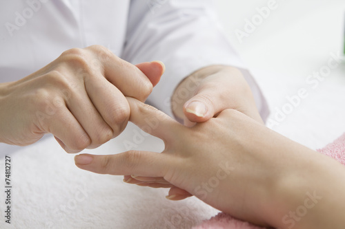 Young women undergoing hand massage