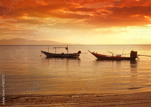 boats in sea at sunset, beautiful sunset
