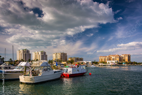 Boats in a marina and hotels along the Intracoastal Waterway in © jonbilous
