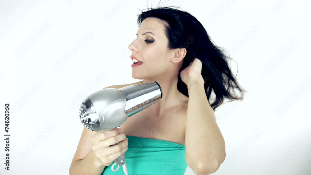 Beautiful woman blow drying long hair isolated stop motion 4K Beautiful woman blow drying long hair isolated stop motion 4K