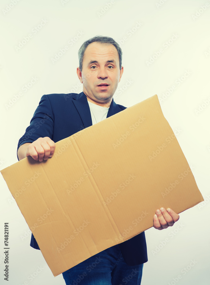 Businessman showing the big blank card in hand Businessman showing the big blank card in hand