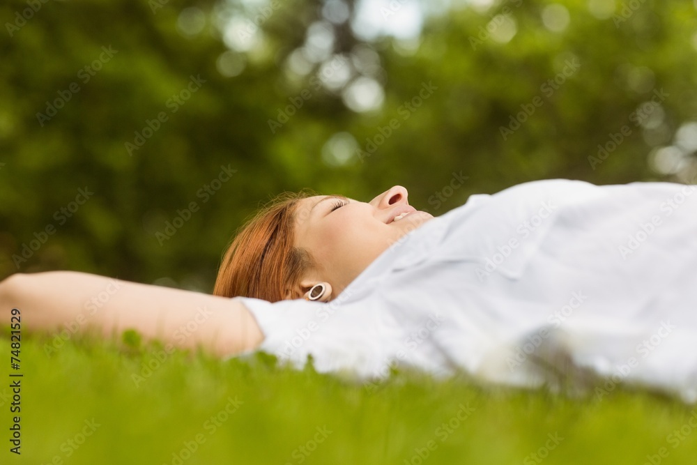 Pretty redhead smiling and lying Pretty redhead smiling and lying