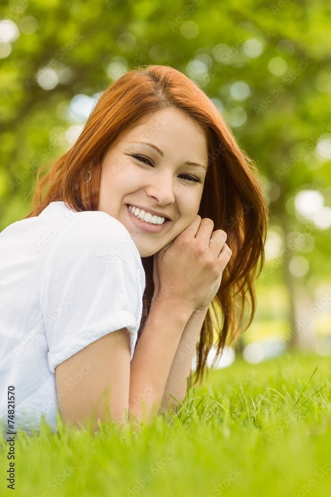 Portrait of a pretty redhead happy and lying Portrait of a pretty redhead happy and lying