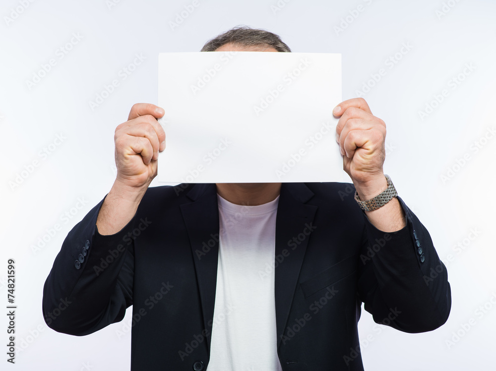 Businessman showing the big blank card in hand Businessman showing the big blank card in hand